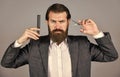 hair tool. fashion and beauty. bearded man brush and cut beard. male grooming with scissors. mature businessman in suit