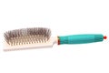 Hairbrush isolated. Closeup of a stylish new green turquoise hair or massage brush or comb isolatedon white. Concept of body and Royalty Free Stock Photo