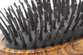 Hairbrush with plastic bristle and wooden pattern handle macro Royalty Free Stock Photo