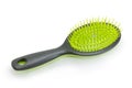 Hairbrush with plastic bristles on a white background