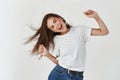 Haircare and beauty concept. Happy young woman dancing and whip healthy shiny hair, having fun, standing joyful over Royalty Free Stock Photo