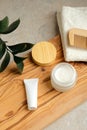 Haircare beauty products set and green leaf on wooden board on bathroom table. Natural organic cosmetics concept Royalty Free Stock Photo