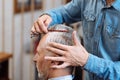 Hairdresser combing hair of old man Royalty Free Stock Photo