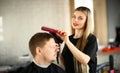 Hairdresser Combing Male Hair and Blowing by Dryer Royalty Free Stock Photo