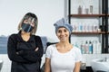 Hairdresser crossed arms, smiling and look at camera at beauty salon. Asian professional female hair stylist work by wash and Royalty Free Stock Photo