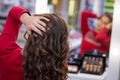 The hairdresser curl hair with figaro in the salon Royalty Free Stock Photo