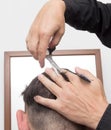 Hairdresser cuts men`s hair cut Royalty Free Stock Photo