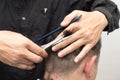 Hairdresser cuts men`s hair cut Royalty Free Stock Photo