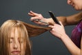 Hairdresser cutting customer's hair