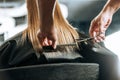 Hairdresser cutting hair to beautiful young woman Royalty Free Stock Photo