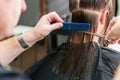 Hairdresser cutting hair of woman Royalty Free Stock Photo