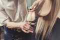 Hairdresser is cutting long hair in hair salon Royalty Free Stock Photo