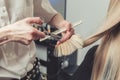Hairdresser is cutting long hair in hair salon Royalty Free Stock Photo