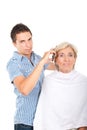 Hairdresser cutting woman hair