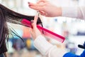 Hairdresser cutting woman hair in shop Royalty Free Stock Photo