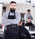 Hairdresser demonstrating his workplace