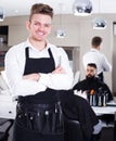 Hairdresser demonstrating his workplace