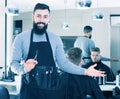 Hairdresser demonstrating his workplace