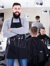 Hairdresser demonstrating his workplace