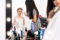 Hairdresser does styling for a girl bride in a beauty salon