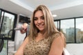 Hairdresser Doing Haircut For Woman In Hairdressing Salon