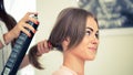 Hairdresser doing haircut for women in hairdressing salon. Concept of fashion and beauty. Positive emotion Royalty Free Stock Photo