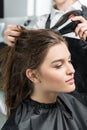 Hairdresser drying hair of woman Royalty Free Stock Photo