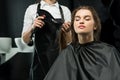 Hairdresser drying hair of woman Royalty Free Stock Photo