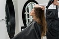 Hairdresser drying hair of woman Royalty Free Stock Photo