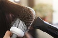 Hairdresser drying woman`s hair in beauty salon Royalty Free Stock Photo