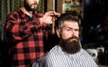 Hairdresser, hair salon. Bearded man. Barber scissors, barber shop. Vintage barbershop, shaving. Man hairstylist. Beard Royalty Free Stock Photo