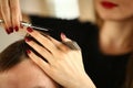 Hairdresser Hands Holding Scissors and Hairbrush