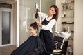 Hairdresser and happy woman, hairdressing salon Royalty Free Stock Photo