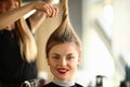 Hairdresser Holding Scissors on Smiling Woman Hair Royalty Free Stock Photo