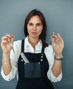 Hairdresser holds scissors in hands, hairsalon