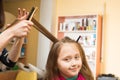 Hairdresser makes the hair style girl