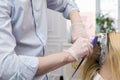 A hairdresser making haircut for a blonde female client Royalty Free Stock Photo