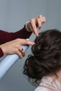 Hairdresser making hairstyle to girl in beauty salon Royalty Free Stock Photo