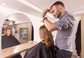 Hairdresser mirror cutting hair sideview Royalty Free Stock Photo