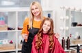 Hairdresser and model girl with curles Royalty Free Stock Photo