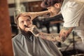 Hairdresser with old-fashioned black razor Royalty Free Stock Photo