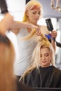 Hairdresser, salon and haircut for female client, comb and clip for hair dry during appointment. Service, beautician and Royalty Free Stock Photo