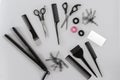 Hairdresser set with various accessories on gray background Royalty Free Stock Photo