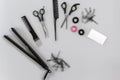 Hairdresser set with various accessories on gray background Royalty Free Stock Photo