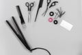 Hairdresser set with various accessories on gray background Royalty Free Stock Photo