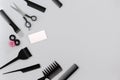 Hairdresser set with various accessories on gray background Royalty Free Stock Photo