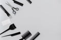 Hairdresser set with various accessories on gray background Royalty Free Stock Photo