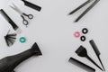 Hairdresser set with various accessories on gray background Royalty Free Stock Photo