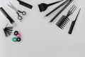 Hairdresser set with various accessories on gray background Royalty Free Stock Photo