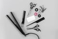 Hairdresser set with various accessories on gray background Royalty Free Stock Photo